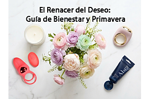 Vista cenital estilo flat lay sobre mármol blanco que muestra el anillo vibrador Lick Ring rojo con su control, el lubricante Abra azul con la marca visible, una vela blanca y un ramo central de flores primaverales en tonos pastel.
